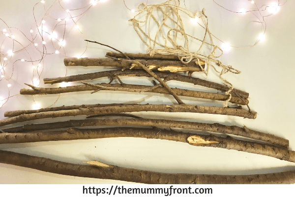 How To Make This DIY Stunning Twig Christmas Tree You Can Make In Less Than 30 Minutes | DIY Christmas Decorations | Rustic Christmas tree | DIY Christmas tree Via https://themummyfront.com #christmastreeideas #christmastree #diychristmascrafts #diychristmasdecorations