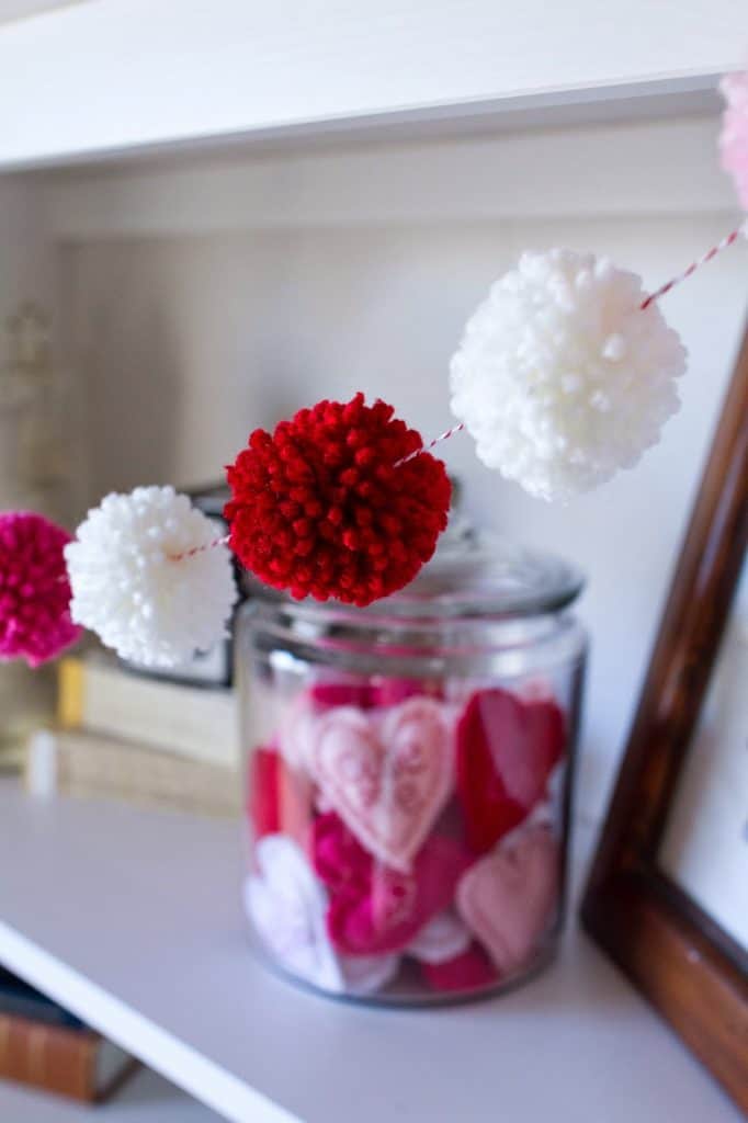 14 Stunning Valentine's Day Decoration Ideas you Will Seriously Fall In Love With This Year! #valentinesdaydecorationideas #valentines #valentinesdaycrafts #valentinesdecor Valentines decor for the home, pom pom garland