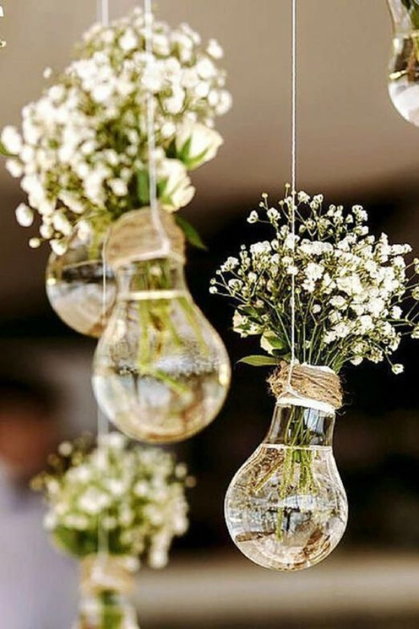 These Glass light bulb wedding decorations are stunning filled with baby's breath