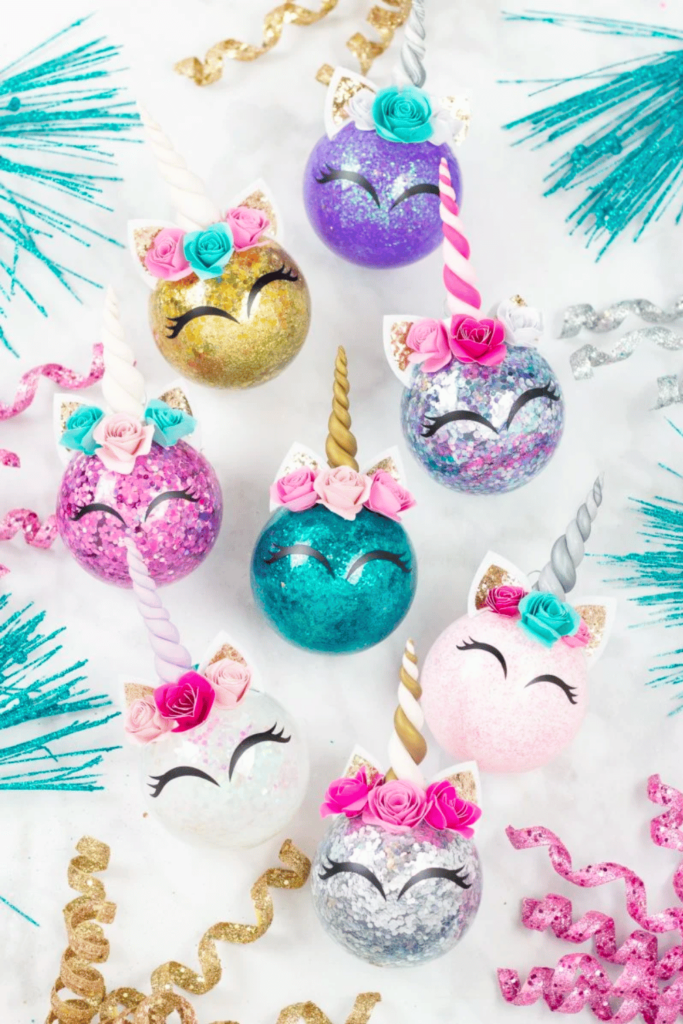 Glass baubles filled with glitter and decorated in a unicorn theme