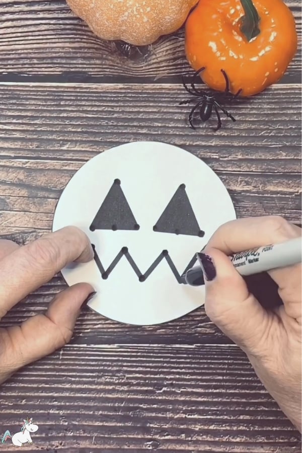 Mark out the face of your pumpkin using a sharpie