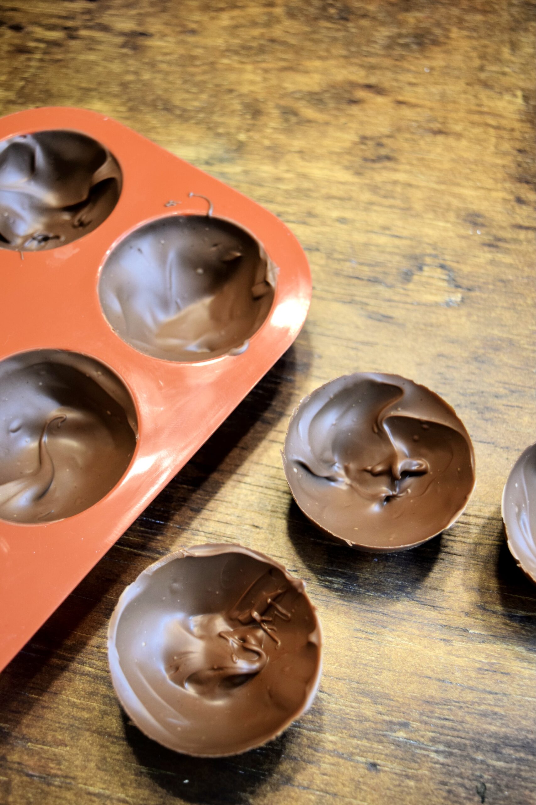 allow the chocolate coated moulds to set fully in the fridge