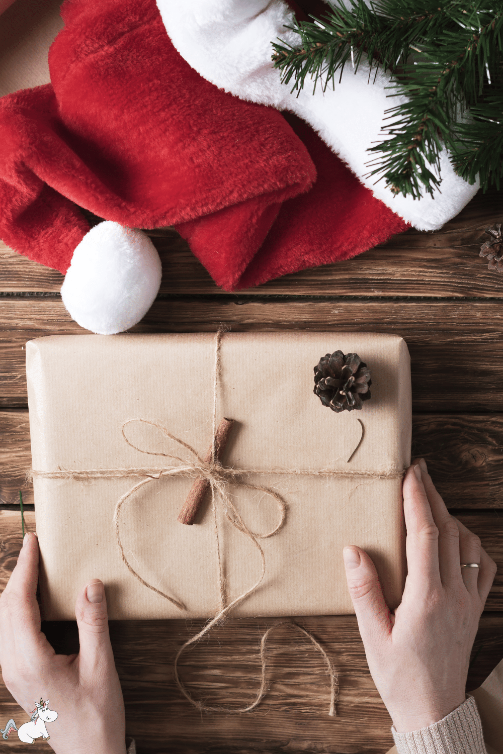 A handmade gift wrapped up with brown paper and a pinecone