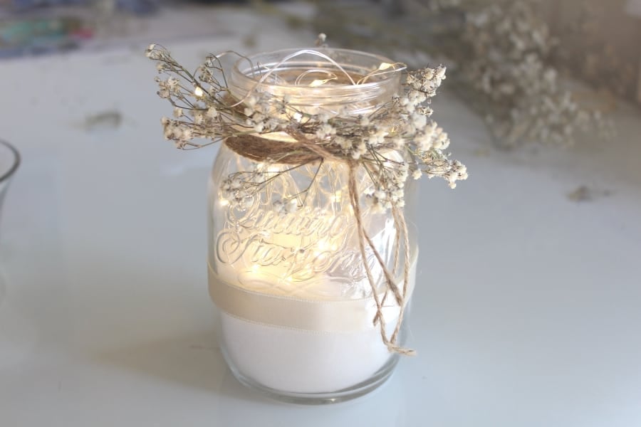Mason Jar Filled With Baby's breath, string lights and epsom salts