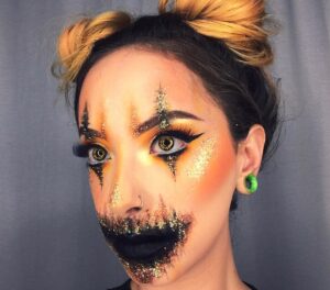 Spooky & Sizzling: 17 Pumpkin Face Paint Ideas For Women - The Mummy Front