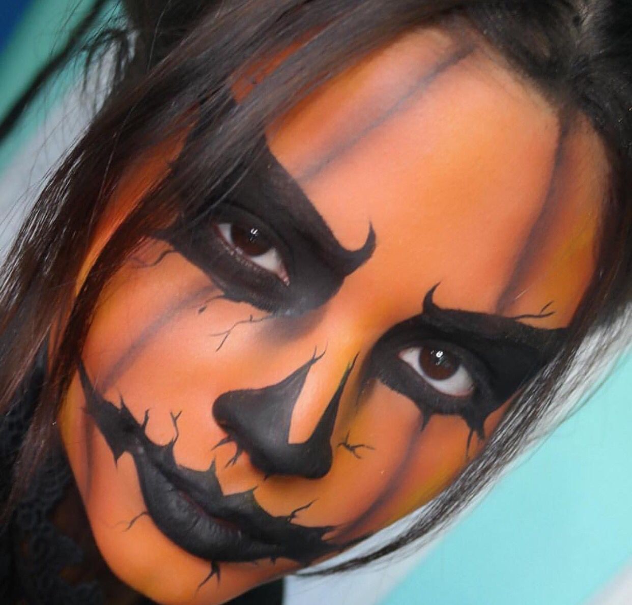 spooky-sizzling-17-pumpkin-face-paint-ideas-for-women-the-mummy-front