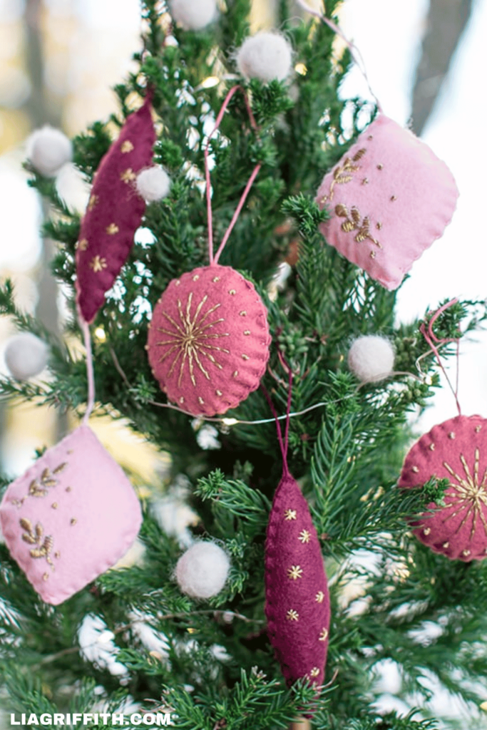 Christmas tree decorated with felt embroidered ornaments in pink