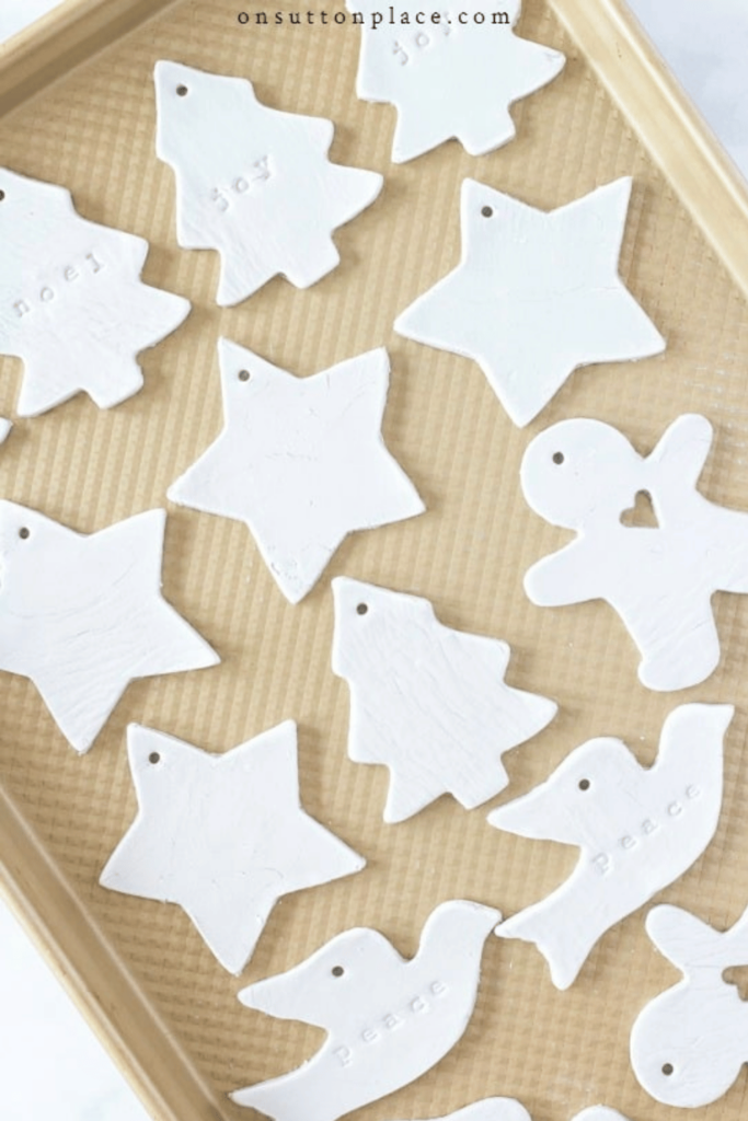 a tray full of gift tags made with white air dried clay