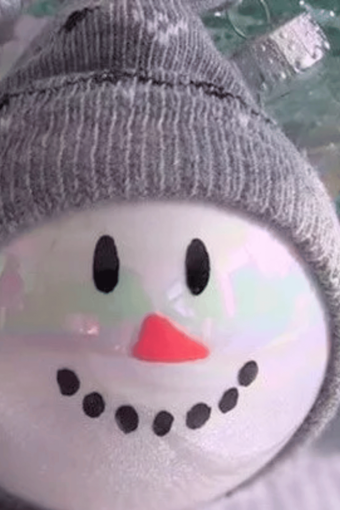 Adorable glass snowman bauble with sock hat