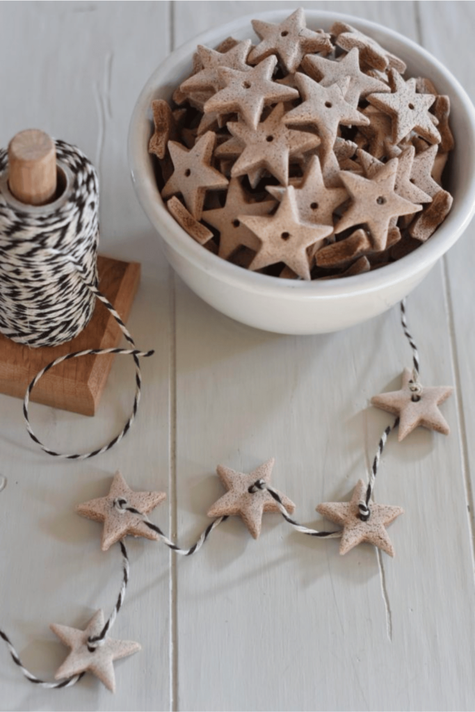 Scented salt dough stars threaded with black & white string.