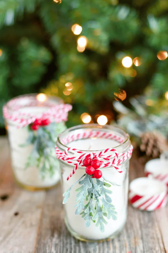 Two festive candle jars filled with peppermint scented wax
