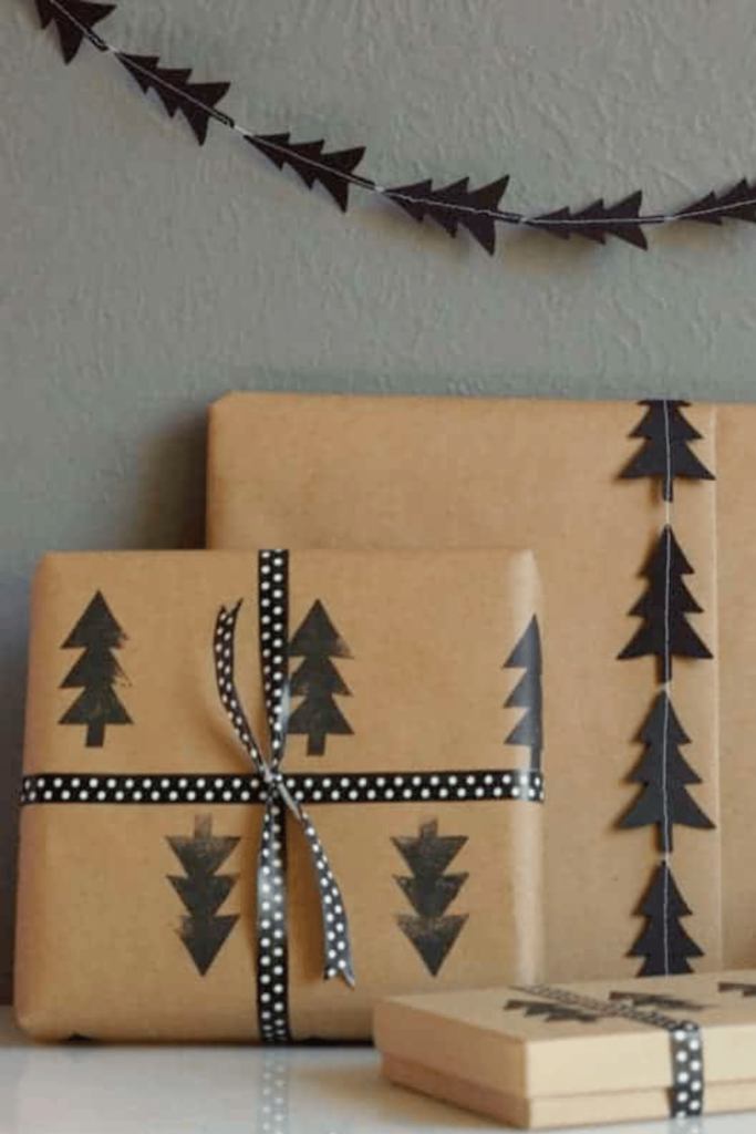 Brown craft paper wrapped gifts with tree stamp decorations