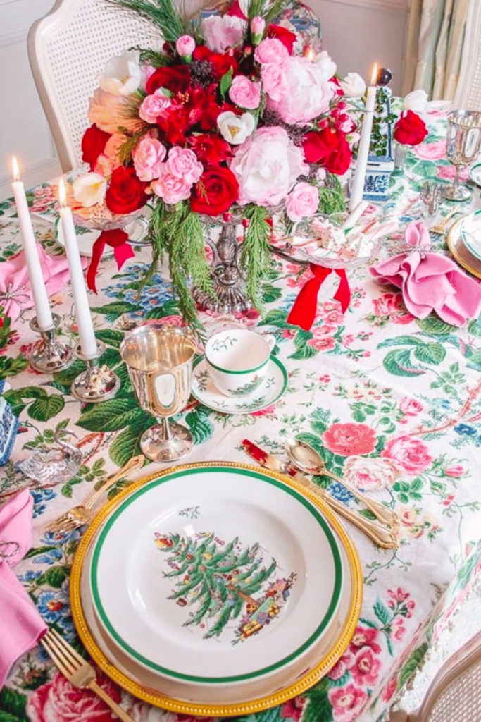 Beautiful flowers on a Chintz tablecloth with Christmas plates