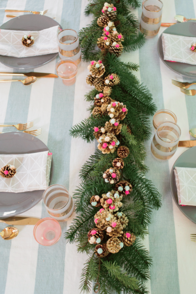 Pine cones decorated with gold glitter and pom poms 