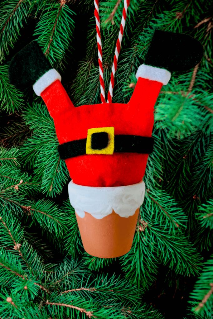 Felt santa stuck in a flower pot