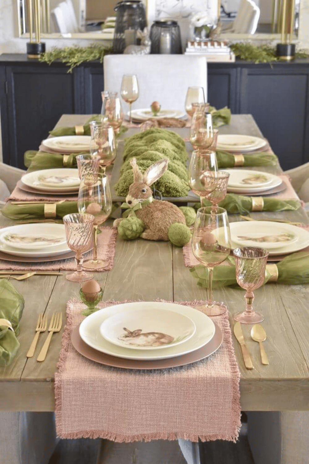 Rustic Easter table setting with moss, a soft pink Easter Tablescape, and a charming Easter Bunny centerpiece.