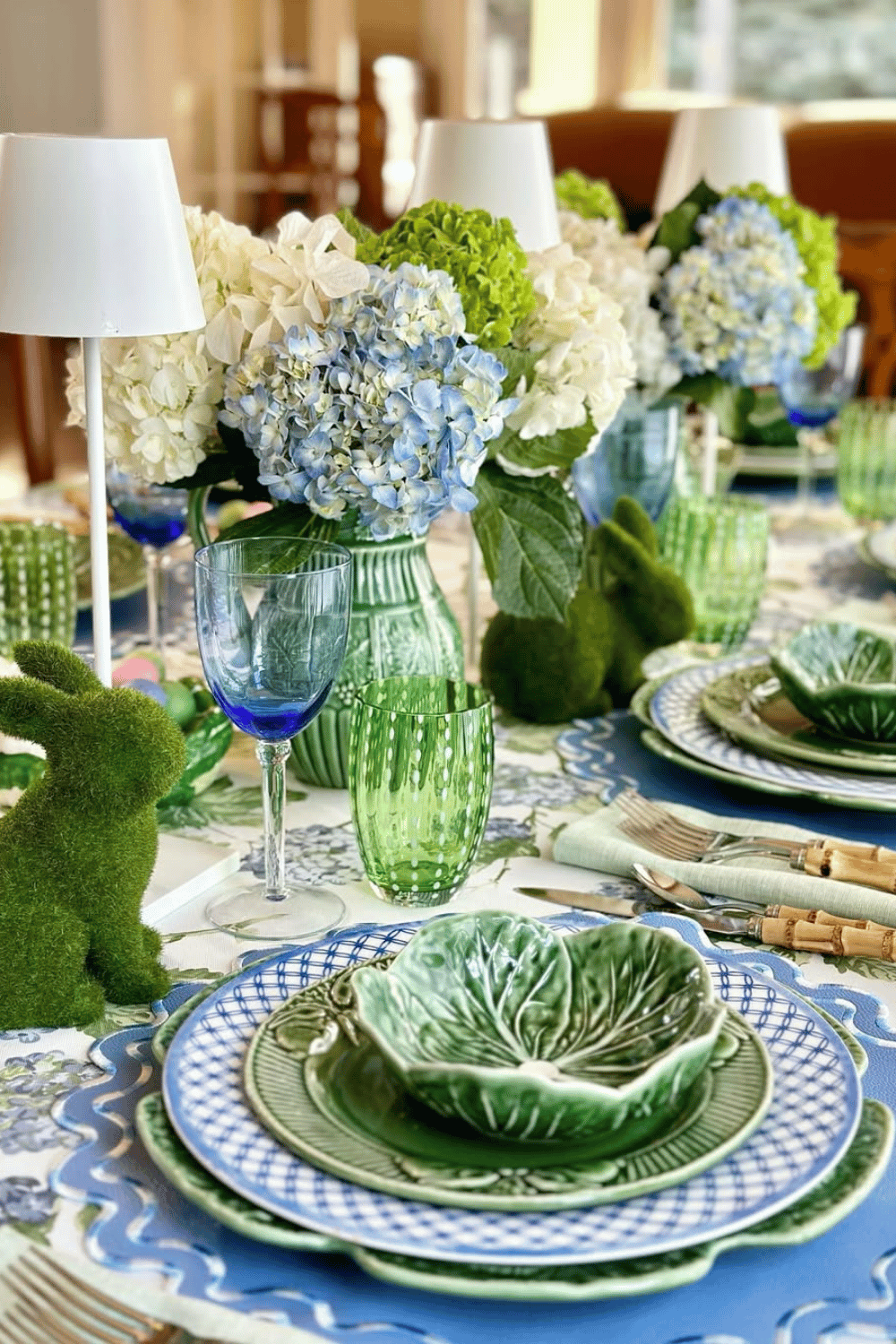 Fresh hydrangea and moss bunny Easter Tablescape with gingham accents for a bright spring look.