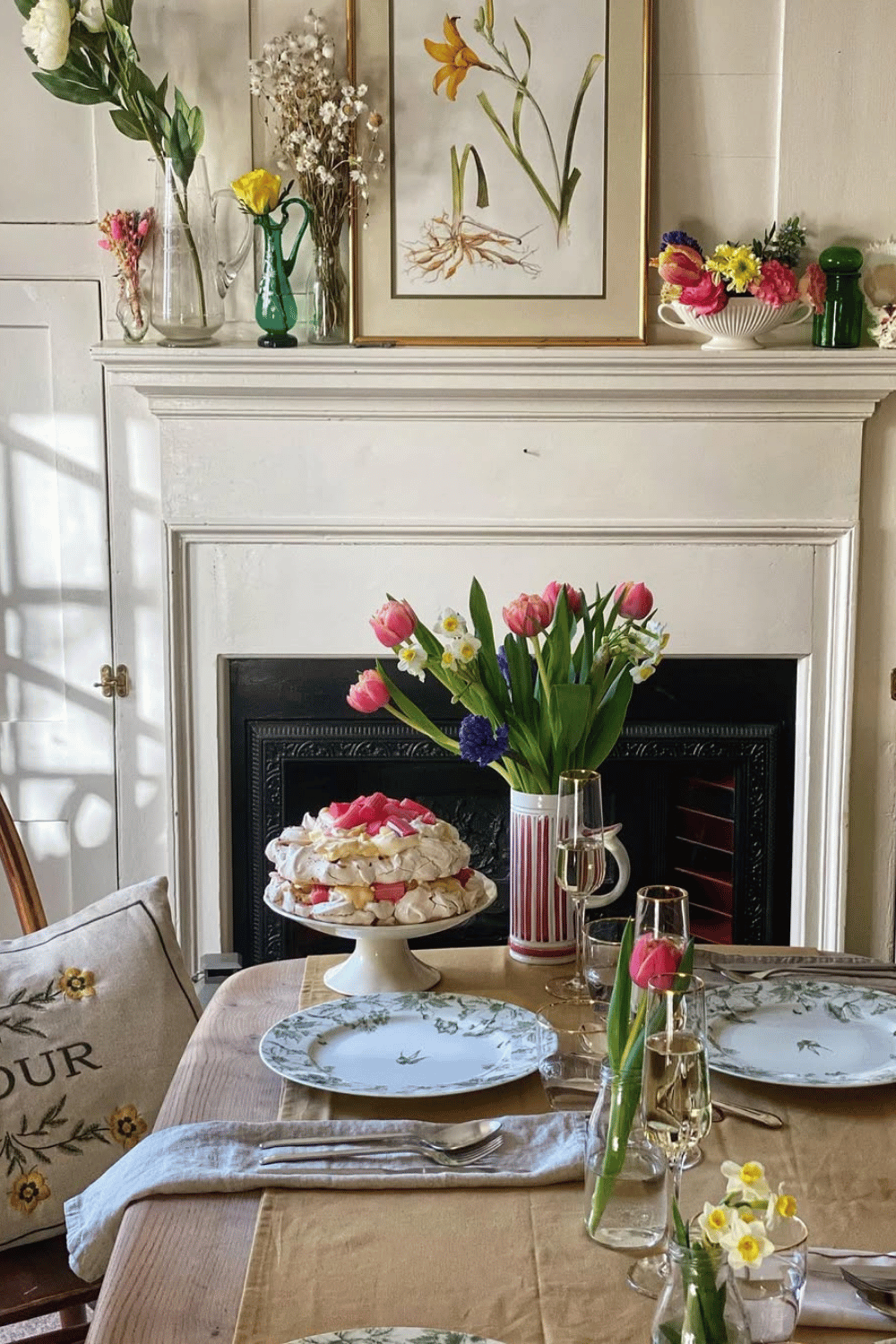 Cottagecore Easter Table Decorations featuring a cozy fireplace, delicate floral china, and fresh Easter hosting ideas.