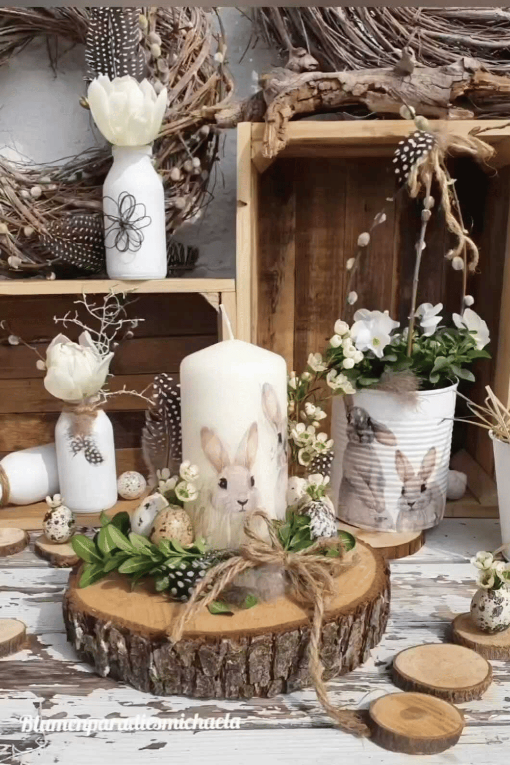 Rustic Easter candle display with wooden slices, faux eggs, and greenery.