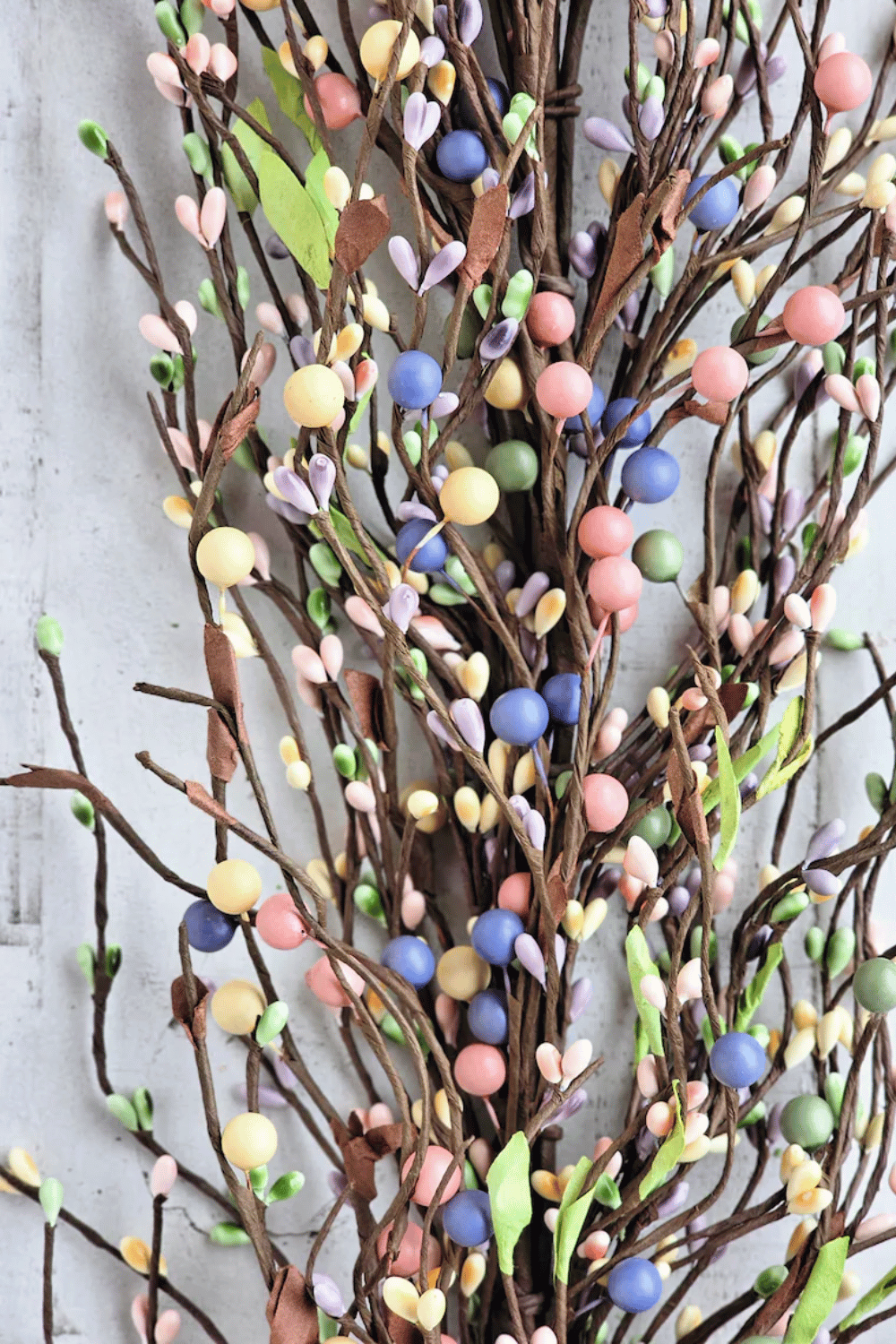 Pastel berry twig wreath for a subtle, colorful Easter touch.