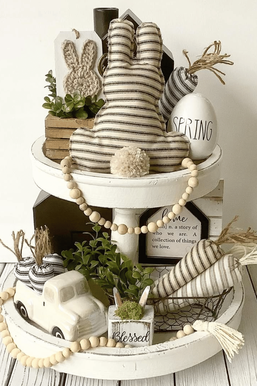 Neutral-tiered tray decorated with farmhouse-style Easter elements.