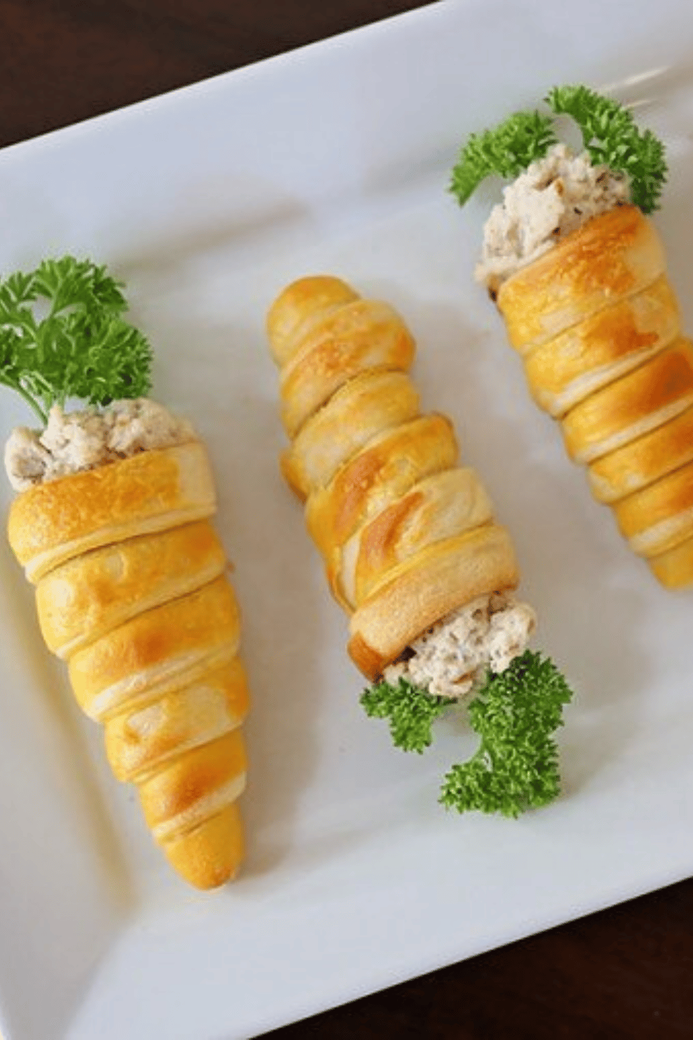 These croissant cone chicken salad carrots are an Easter finger food idea that’s almost too cute to eat and perfect for your Easter gathering!