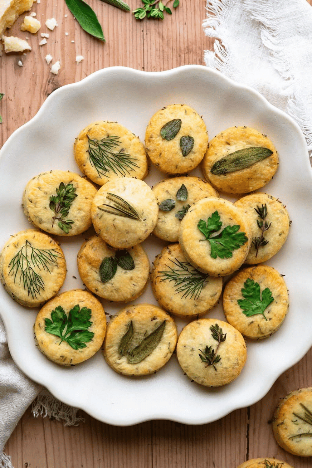 These rustic herb shortbread biscuits are a buttery, melt-in-your-mouth spring appetizer that pairs perfectly with dips for Easter entertaining!