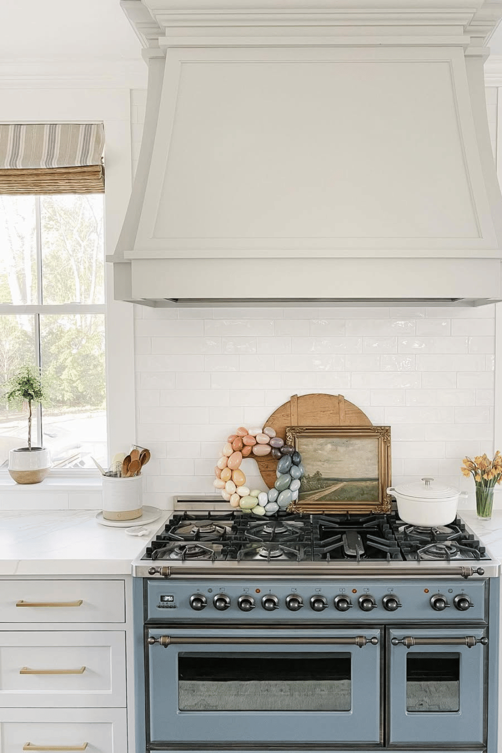 Farmhouse kitchen displays a wreath composed of pastel-colored Easter eggs.