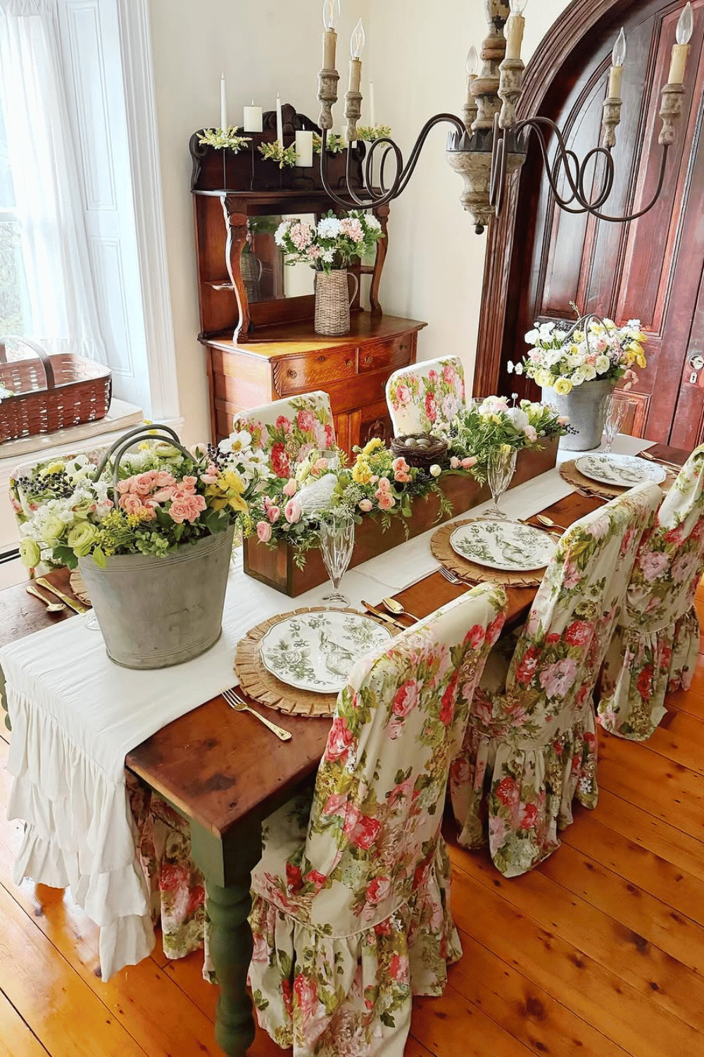 Farmhouse floral trough filled with pastel flowers as vintage-inspired spring centerpiece