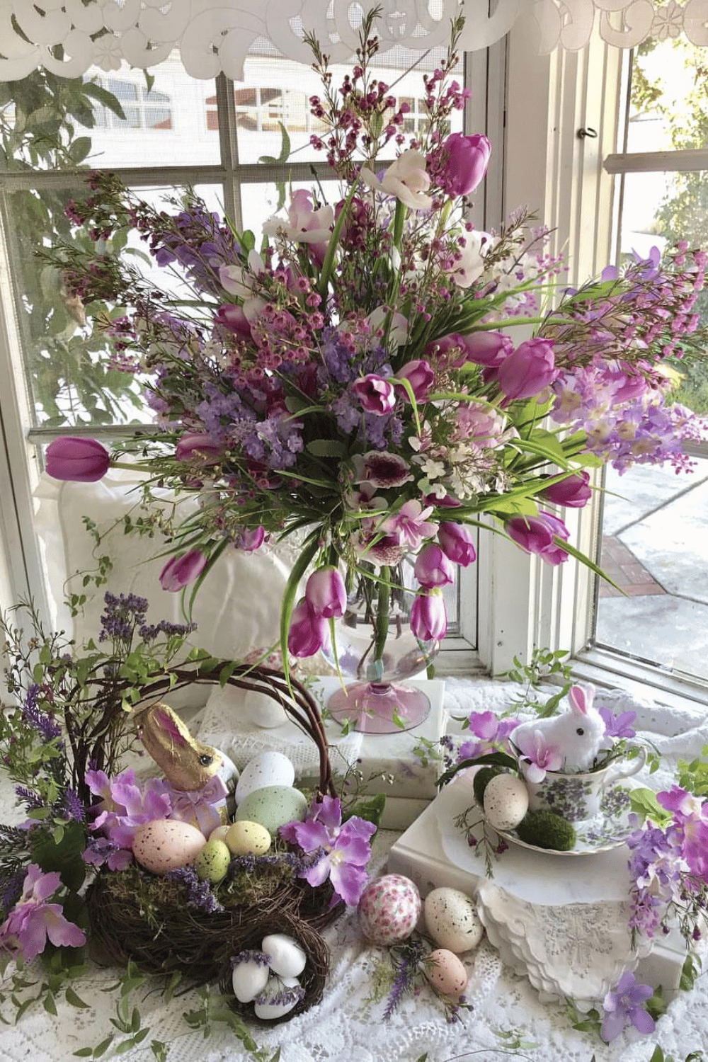 Lavender, tulips, Easter eggs, and nests arranged as festive Easter brunch table decor