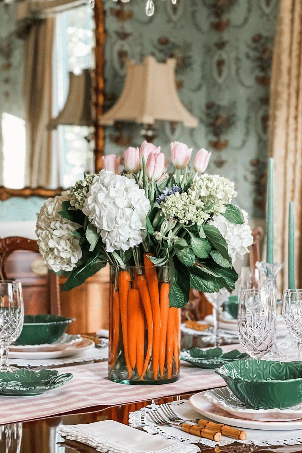 Clear vase filled with carrots, hydrangeas, and tulips as a playful Easter centerpiece