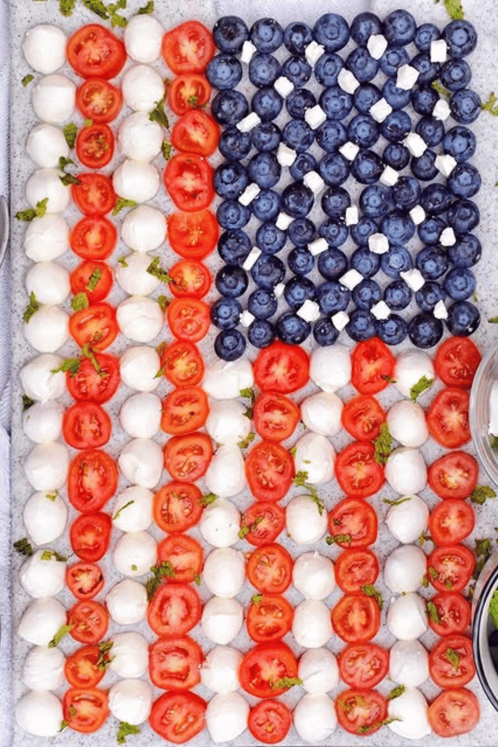 American flag appetizer platter with mozzarella balls, tomatoes, and blueberries