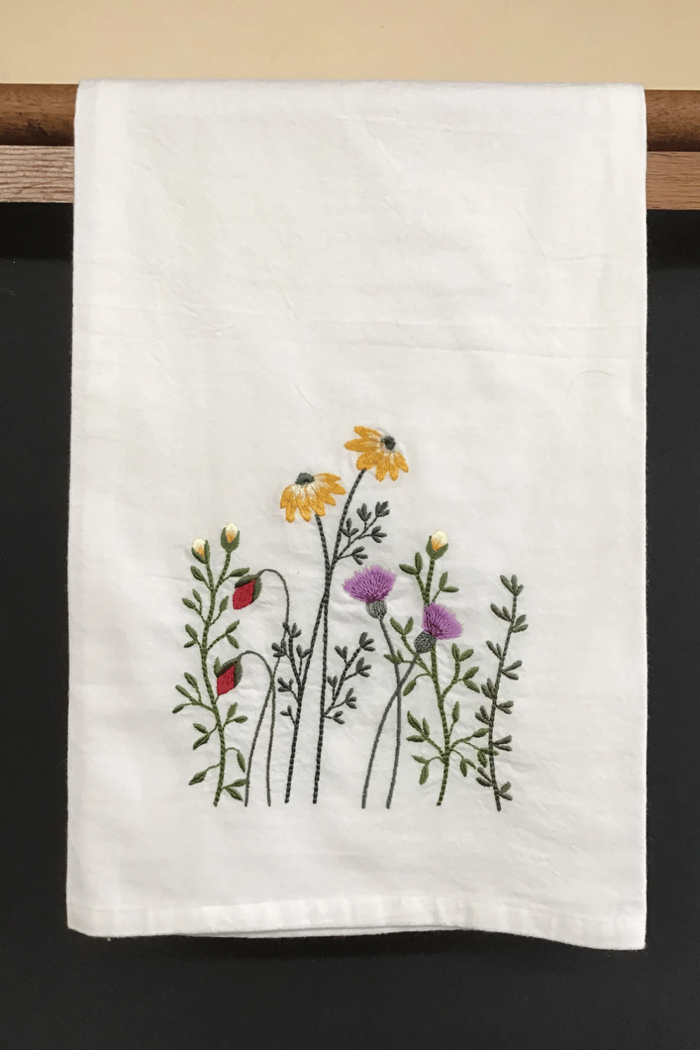 Embroidered kitchen towels with floral and quote patterns