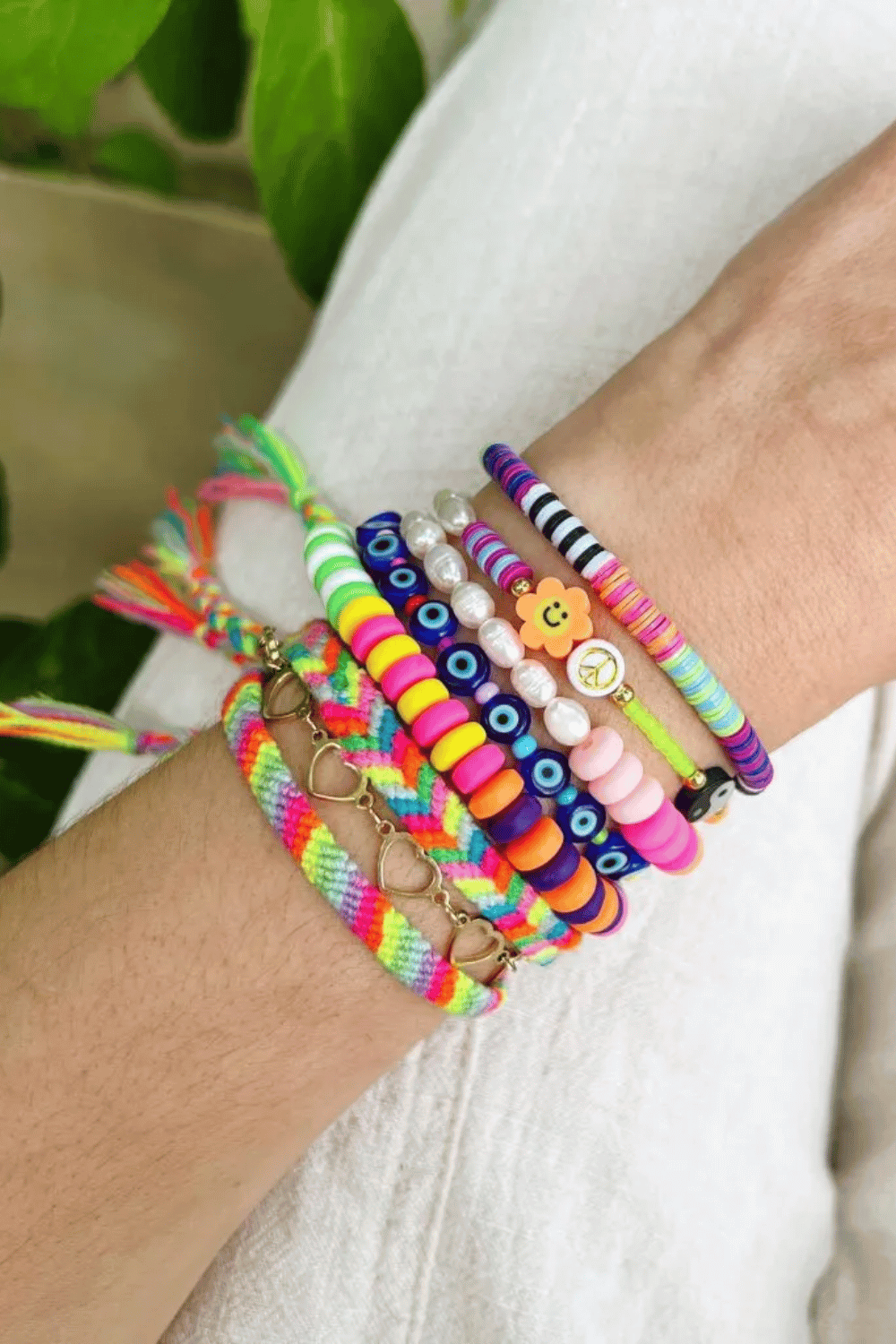 Stretchy beaded bracelets laid out in different color patterns