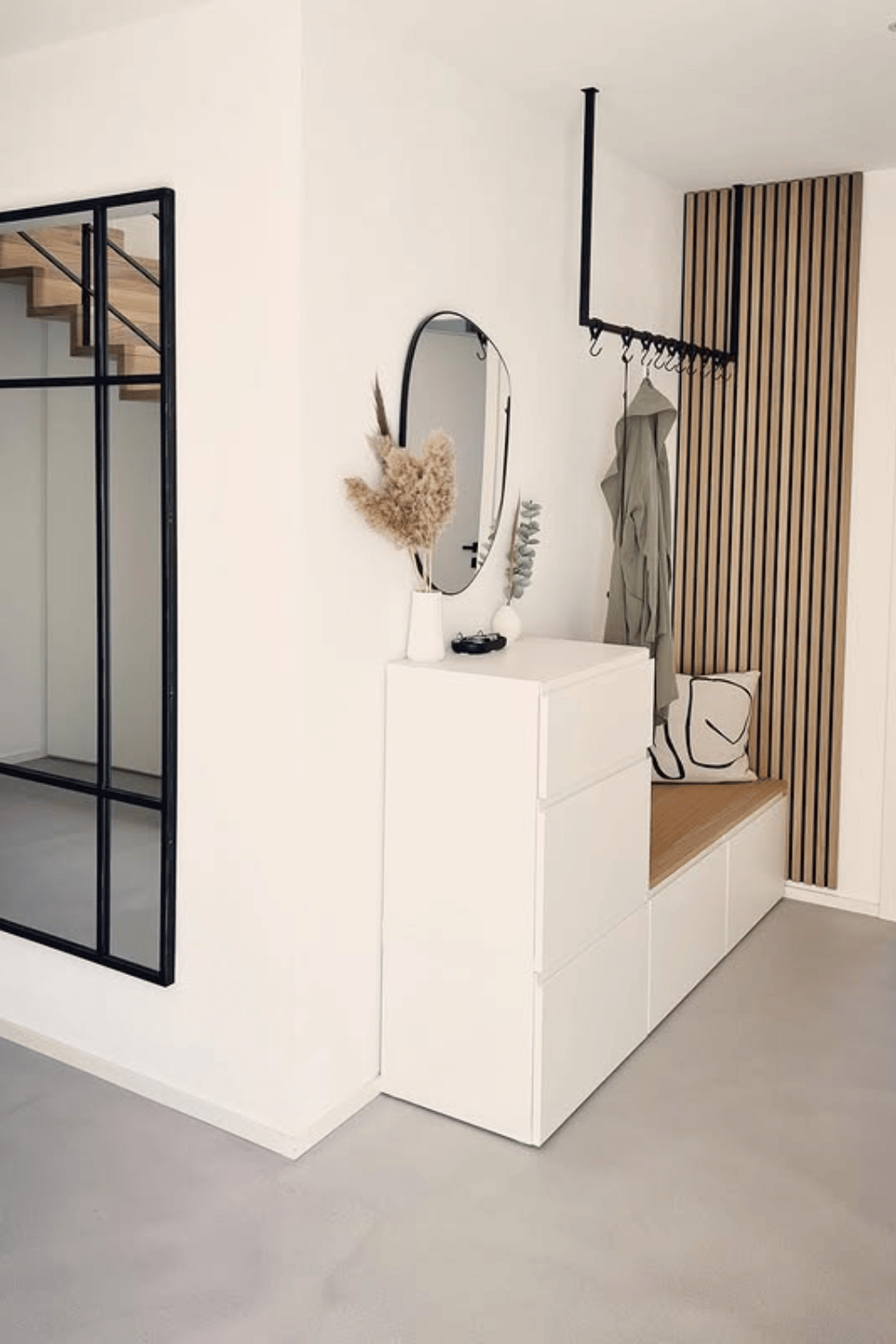 Modern entryway bench using Ikea Besta storage units with wood slat wall minimal hallway idea