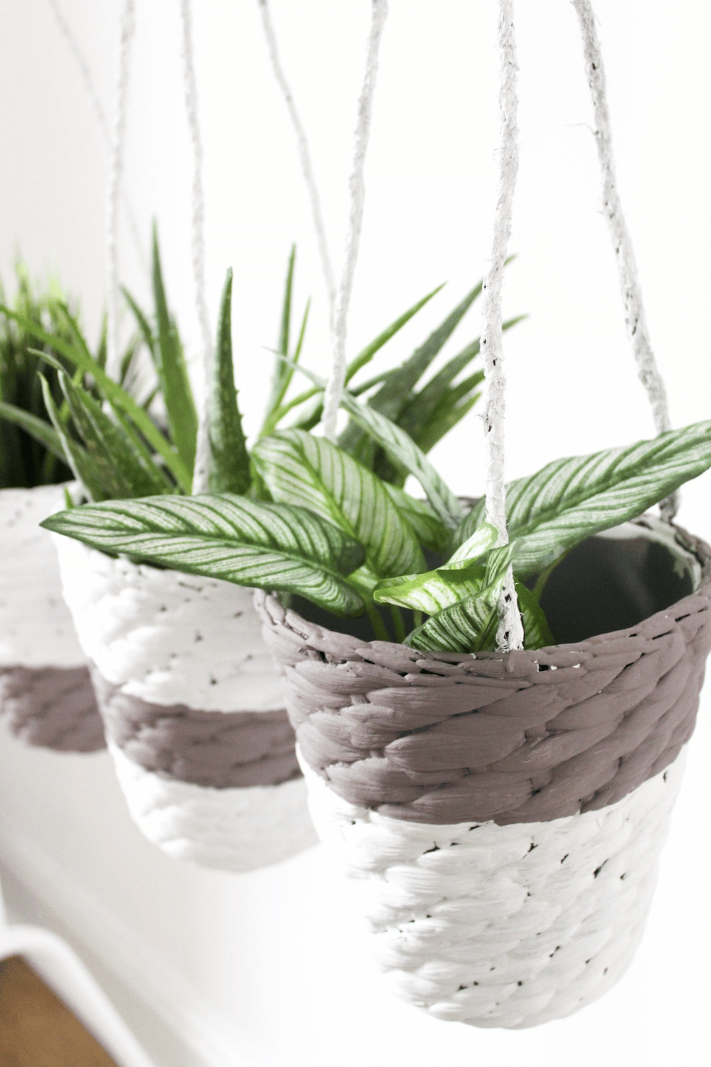 Boho style hanging planters using Ikea baskets small space decorating idea