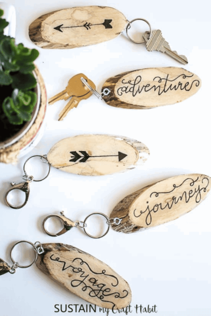 Rustic wooden keychains with calligraphy-style inspirational words
