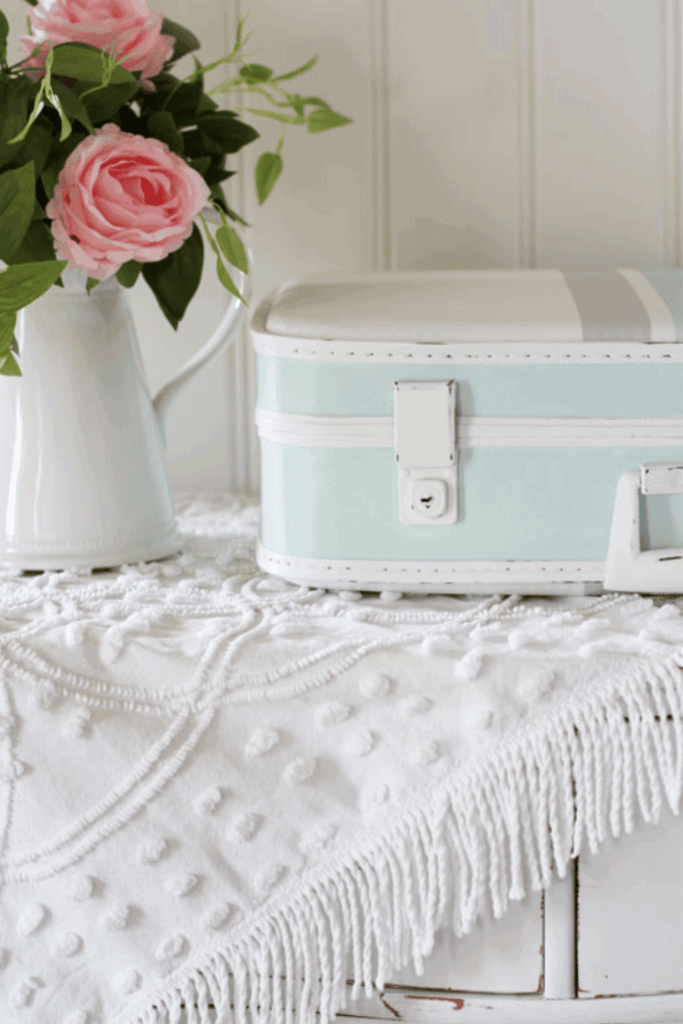 Vintage-style upcycled dresser with white textured fabric and pink flowers