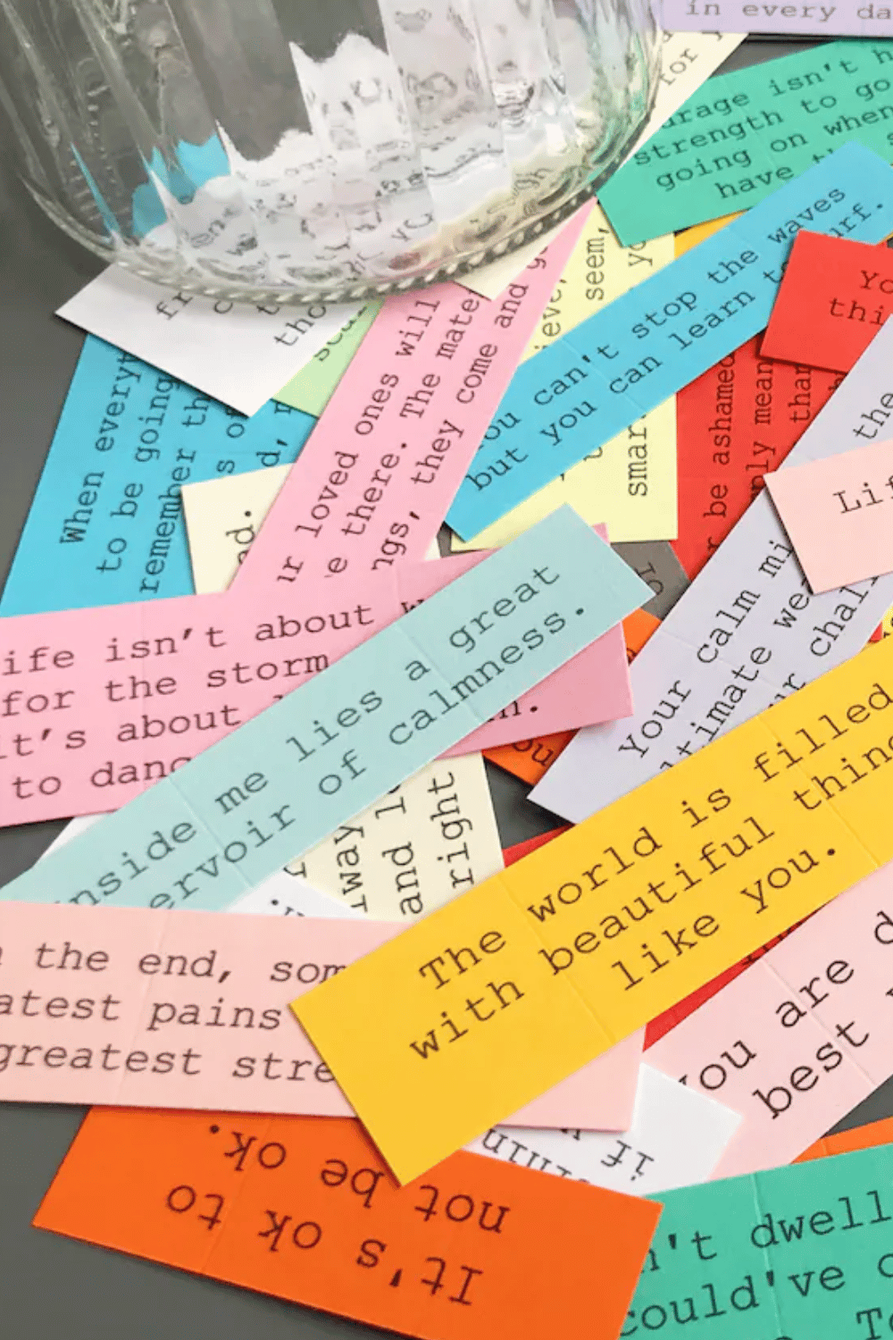 Colorful affirmation notes in a jar with positive and heartfelt messages