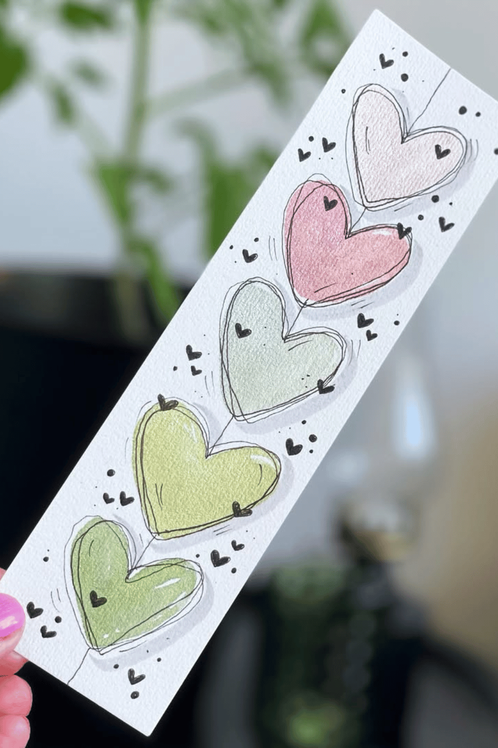 Watercolor heart-shaped DIY bookmark in pastel shades
