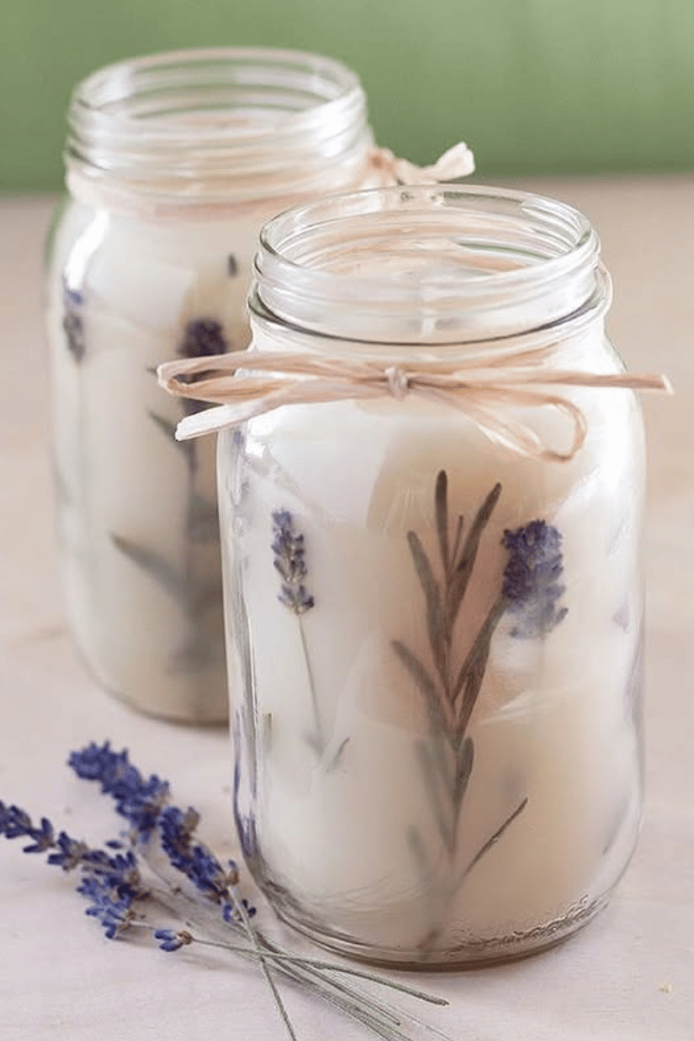 Lavender mason jar candles with dried sprigs and rustic ribbon