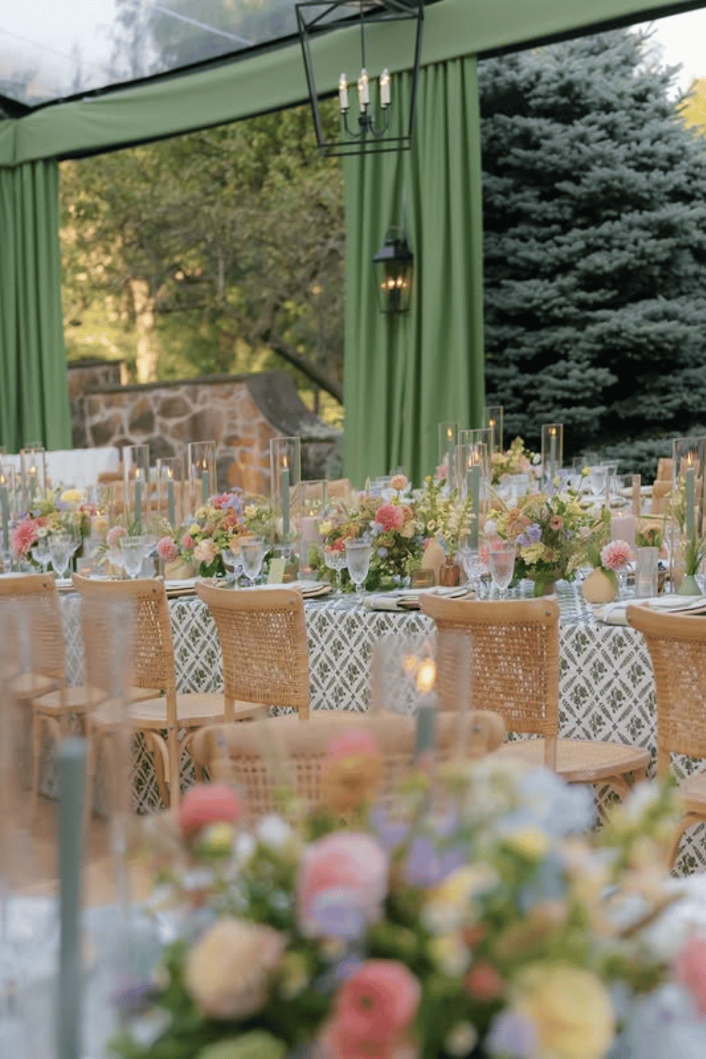 Pastel garden wedding table with patterned linens and soft floral accents