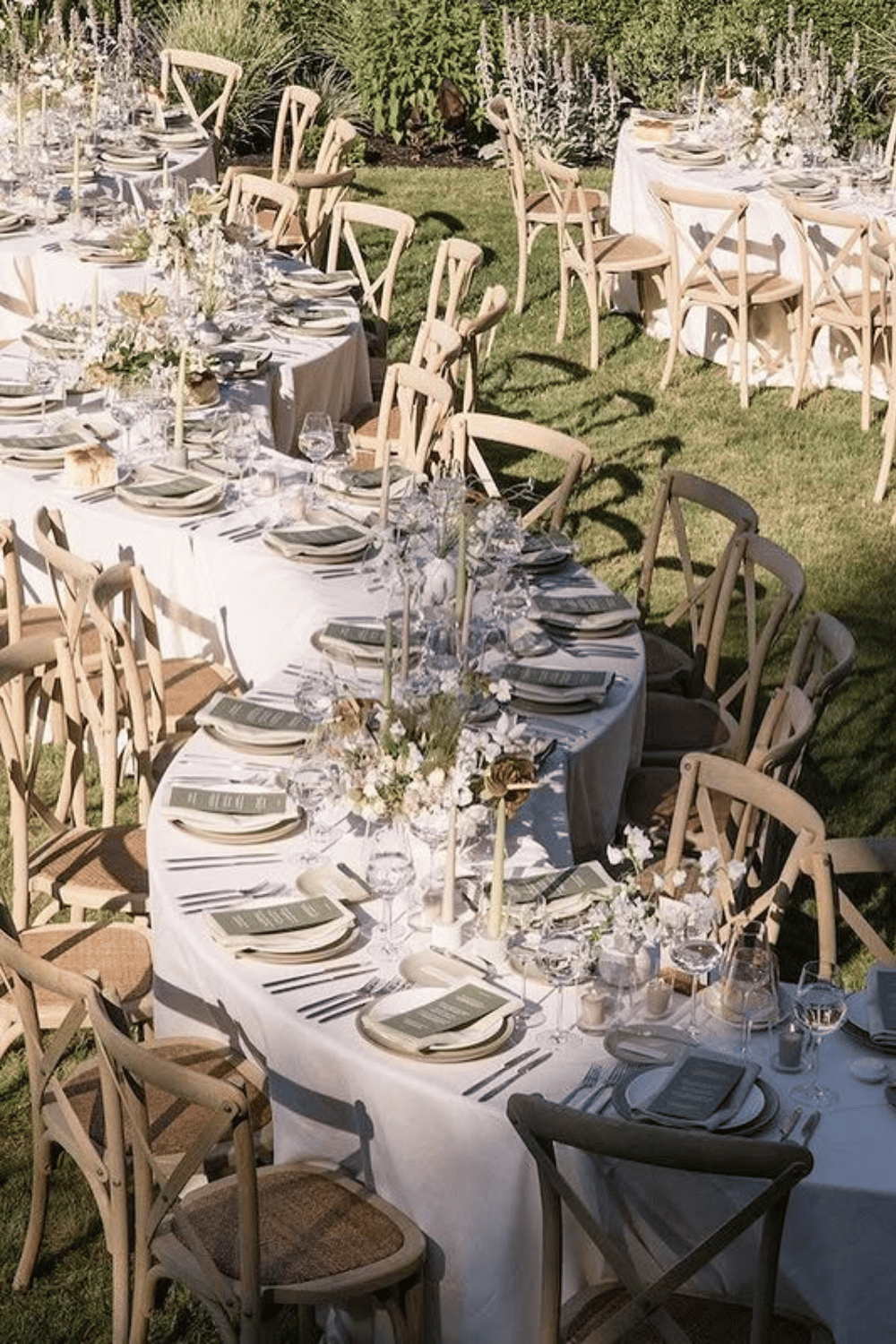 Neutral garden wedding table with green runners and organic textures