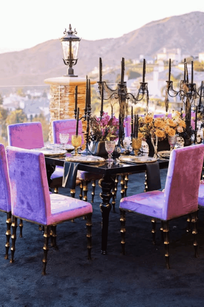 Halloween table with purple velvet chairs and gold accents