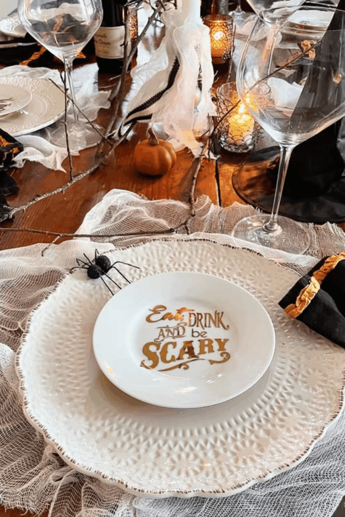 White Halloween plates with “Eat, Drink, and Be Scary” lettering