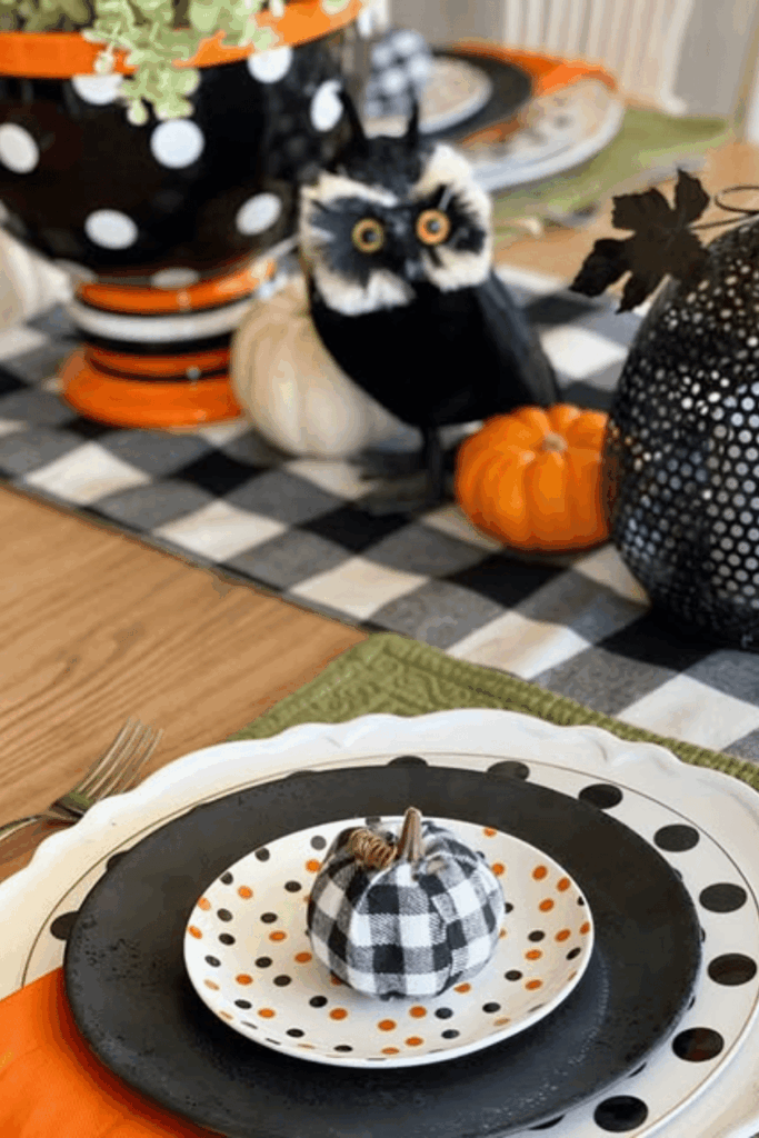Halloween table with buffalo check details and small pumpkin decor