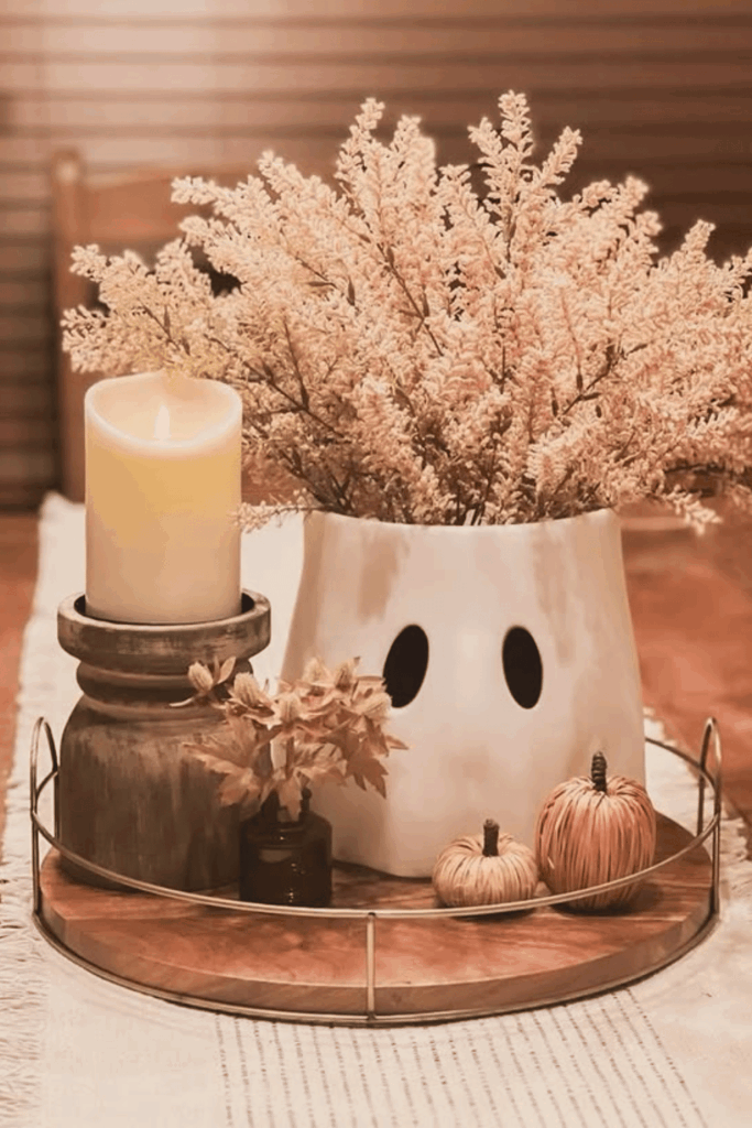 Ghost vase Halloween centerpiece with flowers and candles