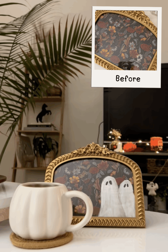 Minimalist ghost duo painted over dark florals, styled with cozy Halloween decor.