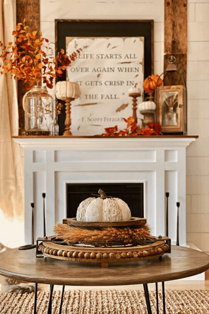 Autumn season harvest mantel with framed print and pumpkins