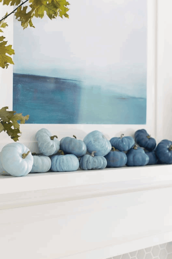 Blue pumpkins styled for unique autumn season mantel idea